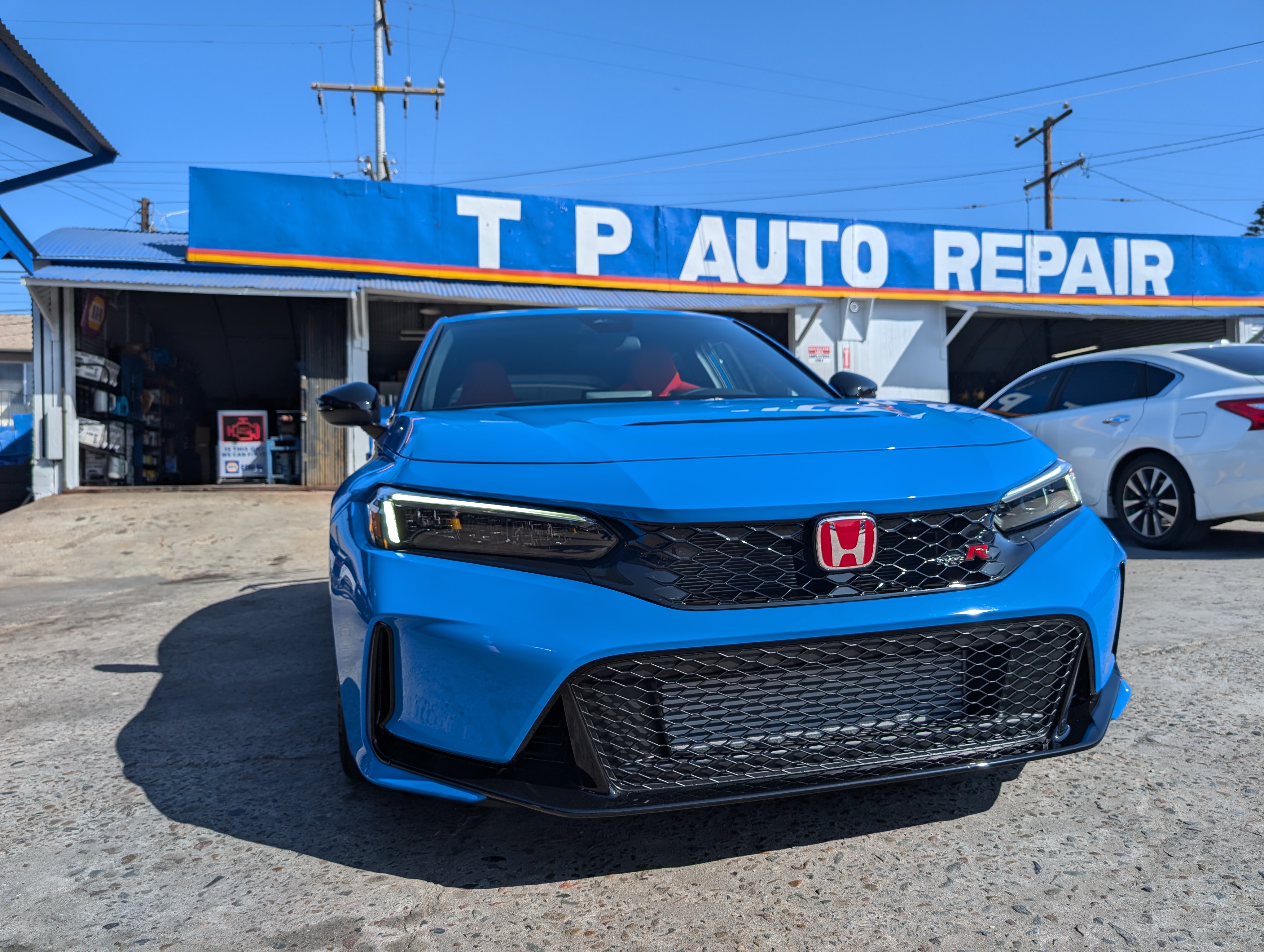 Boost Blue Civic Type R at Shop Entrance